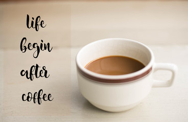 Life begin after coffee words on cup of coffee on the table.