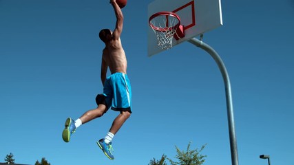 Super slow motion shot of basketball basketball slam dunk, shot on Phantom Flex  - Powered by Adobe