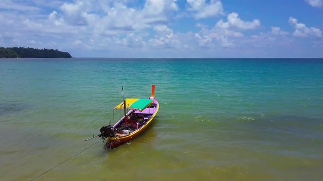 Air flight over the fishing boat in the sea