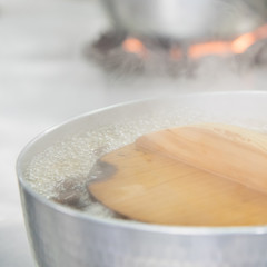 wakame in boiled dashi soup with steam in kitchen