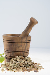 Raw Organic Cardamom Pods Ready to Use with mortar made from olive wood