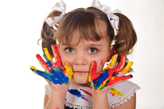 Little girl with hands soiled