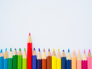 Color pencils on white paper. Education material back to school, for background and wallpaper.