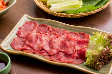 Raw beef tongues on plate in Korean restrant