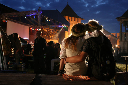 Young couple relaxing at an open-air music festival