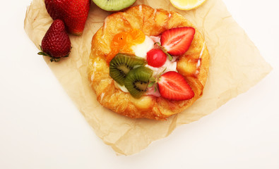 danish pastry with strawberry, kiwi and tangarine