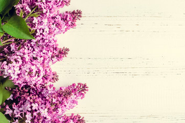 Beautiful lilac on a wooden background
