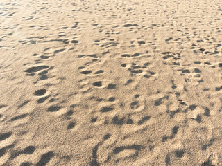 closeup of sand pattern of a beach in the summer