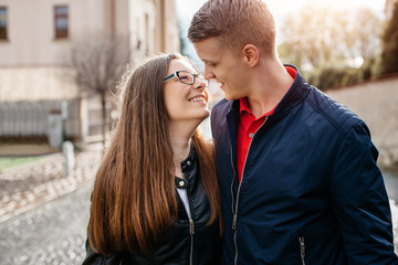A young couple in love embracing and looking into each others eyes