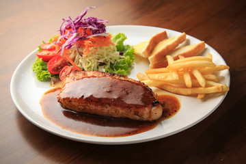 Pork chops with Black Thai Chili Sauce wooden background