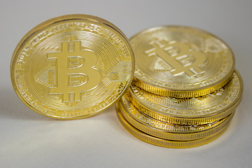 Photo Of Golden Bitcoin virtual currency coin.