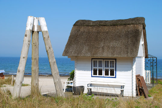 Typical small thatched roof house in Scharbeutz, Germany