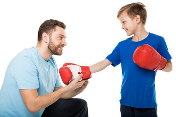 Happy father and son with boxer gloves isolated on white