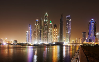 Dubai waterfront skyline at night, United Arab Emirates.