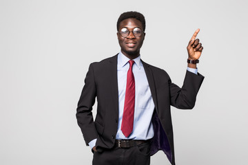 Businessman pointing at something on grey background