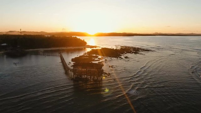Viewpoint in the ocean at Cloud Nine surf point, Siargao island , Philippines. Aerial view raised wooden walkway for surfers to cross the reef of siargao island to cloud 9 surf break mindanao. Siargao