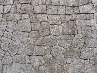 The wall of the large and rough stones. In warm tones