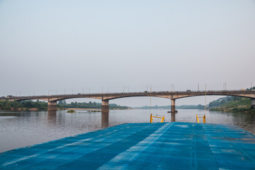 Fototapeta na wymiar Bridge on the river on a summer evening