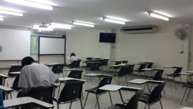 Blurred, Blurred Background, Blurred Abstract, Classroom with people. Students Sitting classroom and doing final exam