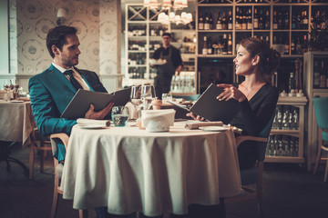 Couple reading menu in a restaurant