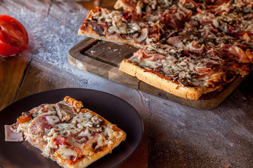 Thick crust pizza on wooden plateau