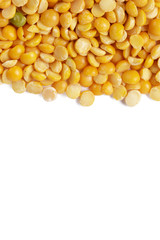 Dry yellow split peas isolated on white.
