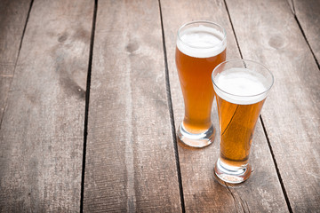 glass beer on wood background