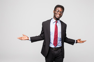 business man african american doing a balance on grey background