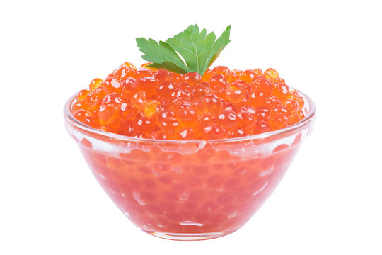 A serving of red caviar with greens on a white background