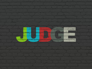 Law concept: Judge on wall background