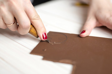Handmade, close-up of a hand carve a linocut