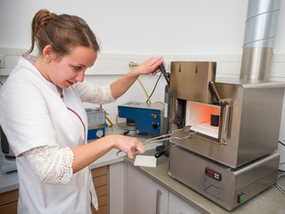 Dental Technician preparing the oven