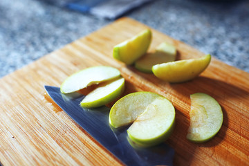 Sliced green apple on the table