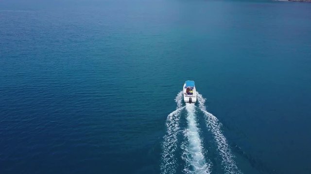 Air flight over the boat in the sea