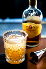 Classy orange cocktail in embossed glass