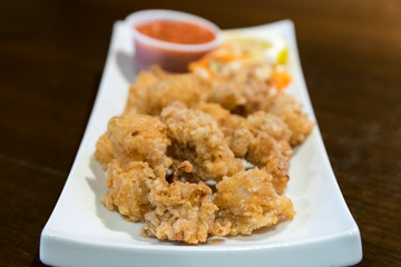 Golden brown deep fried calamari, served with seafood sauce.