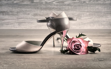Argentine tango shoes with a rose on wood