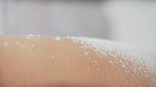 Woman using powder talc for sugaring process