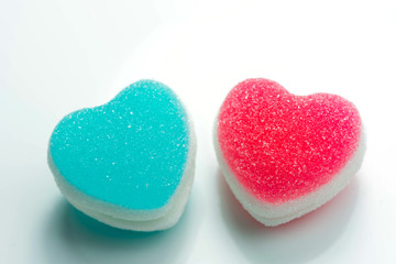 Obraz premium Heart candies coated with sugar, heart colorful sweet candies, sugar heart shaped candy