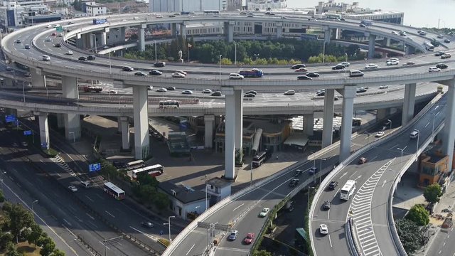 time lapse,Aerial freeway busy city rush hour heavy traffic jam highway Shanghai china,nanpu overpass interchange.