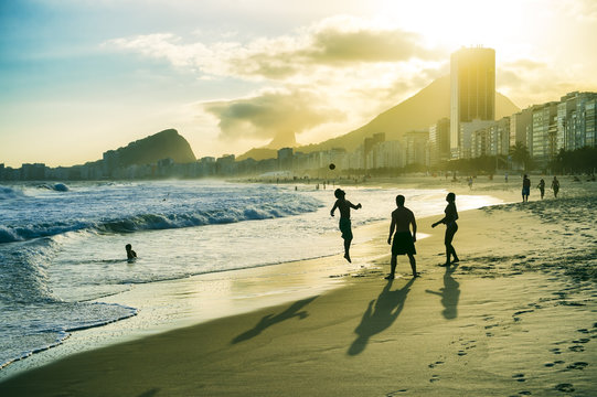 Young Brazilians play a casual round of keepy-uppy in a circle on Copacabana Beach in Rio de Janeiro, Brazil