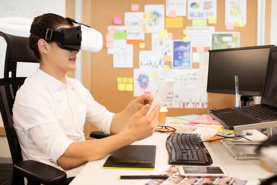 Man wearing vr glasses in creative office