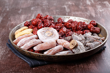 Dried fruits - persimmon, figs, red dates or jujube and salted sliced plum.
