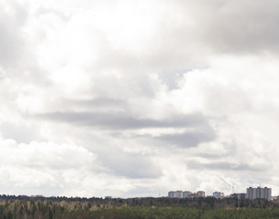 Cloudy sky over the city. Background of the overcast sky