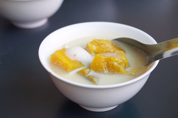 Pumpkin in sweet coconut milk with fresh coconut- Stewed Pumpkin in coconut cream, Thai style dessert, This dessert tastes good hot or cold.