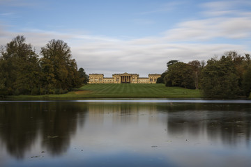 Fototapeta na wymiar Stowe House from the bank of the Octagon Lake