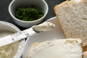 White bread sandwiches, fresh greenery and curd cheese closeup shot