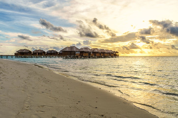 Maldives bungalows at sunset