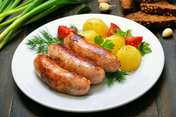 Grilled sausages and vegetables