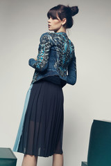 Model in a stylish skirt and jacket 